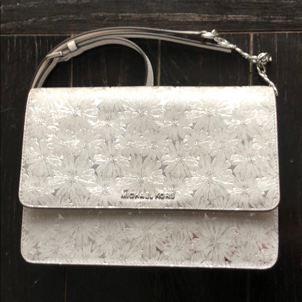 Michael Kors flower crossbody purse gently used